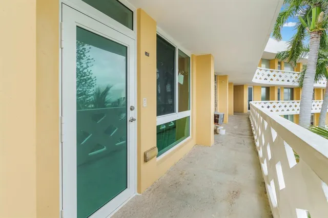 a bedroom with a bed a desk and chair