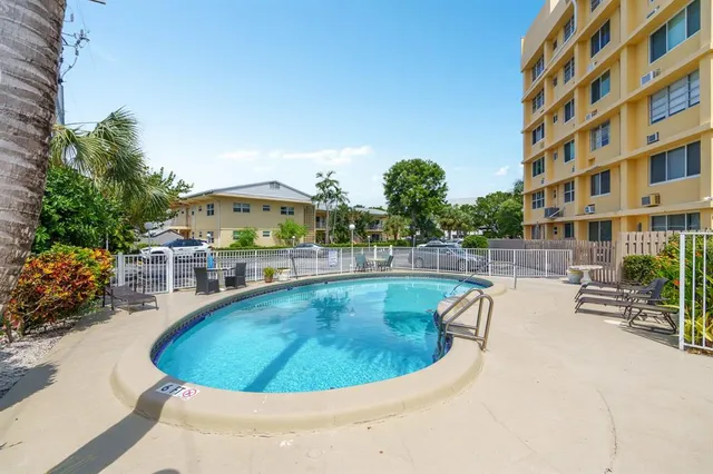 a view of an entryway with wooden cabinet