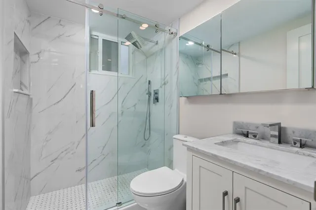 a bed sitting in a room next to a window