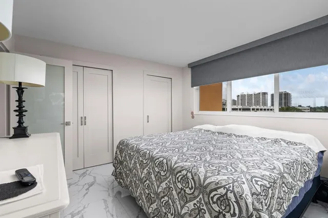 a kitchen with stainless steel appliances a refrigerator and a stove top oven