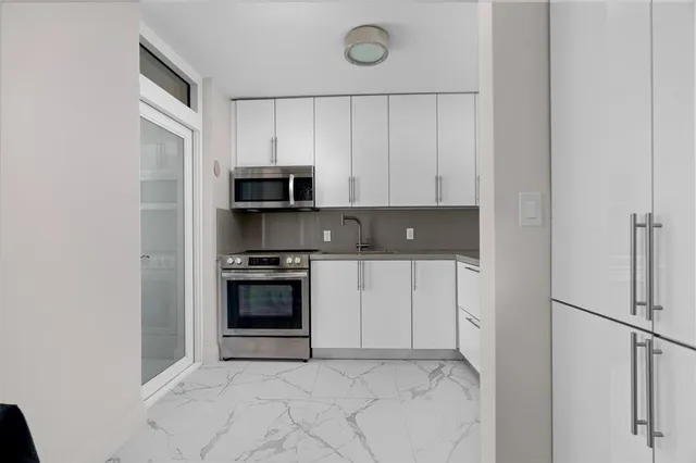 a kitchen with a stove and a microwave