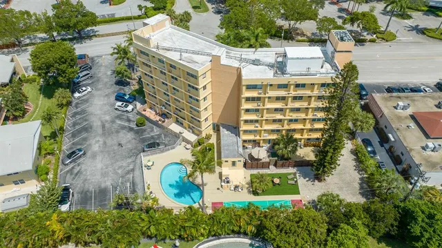 a view of a swimming pool with a table and chairs