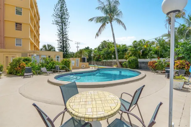 a view of swimming pool with seating space