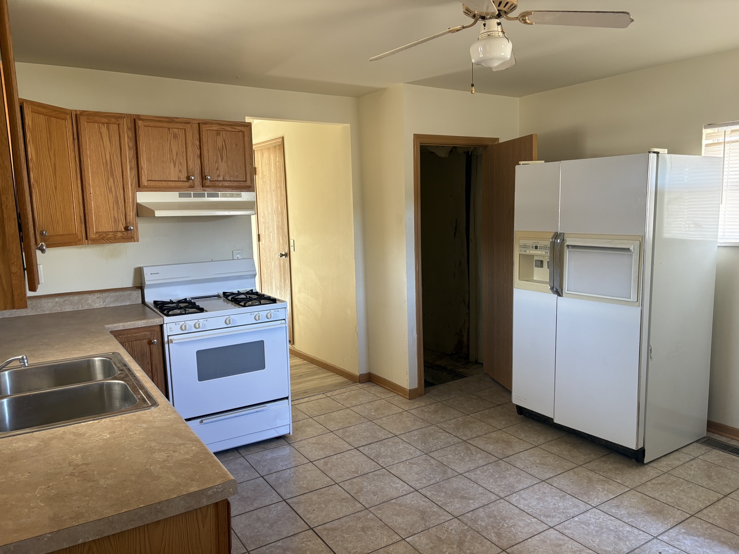 221 North 9th Street Rochelle, IL 61068 - Photo 4 of 17 a kitchen with stainless steel appliances granite countertop a refrigerator and a stove