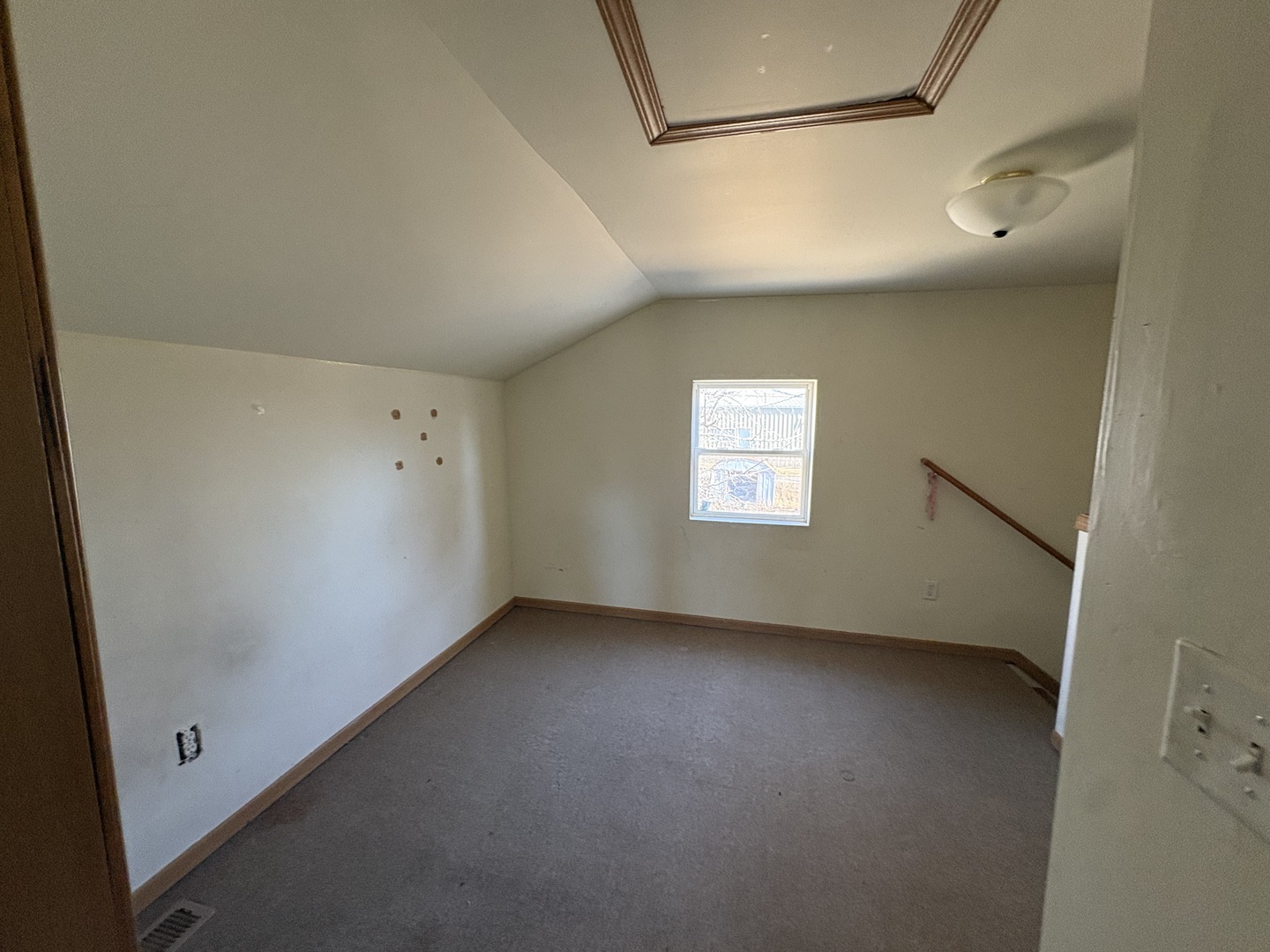 221 North 9th Street Rochelle, IL 61068 - Photo 10 of 17 a view of an empty room with a window