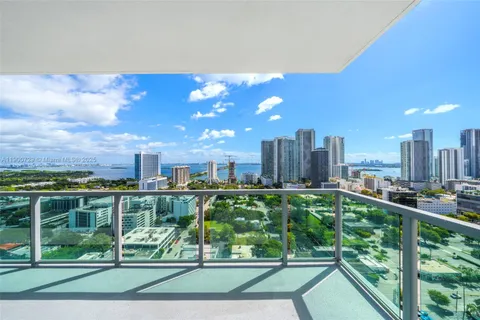 a view of a city with tall buildings