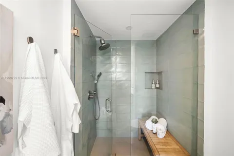 a en suite bathroom with a sink and a mirror