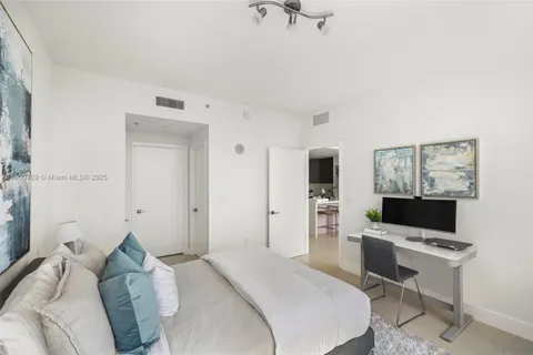 a bathroom with a sink a tub and a mirror