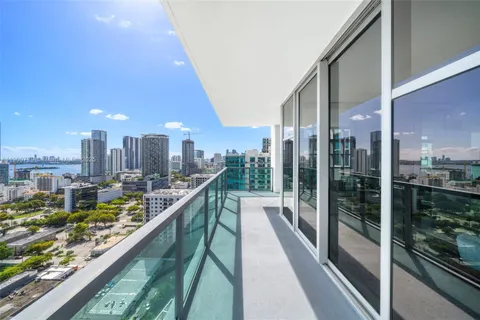 a view of a balcony with lake view and a floor to ceiling window