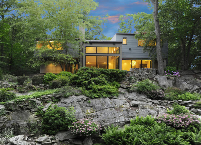 29 Horseshoe Road Cos Cob, CT 06807 - Photo 1 of 42 a view of a house with a yard and a garden