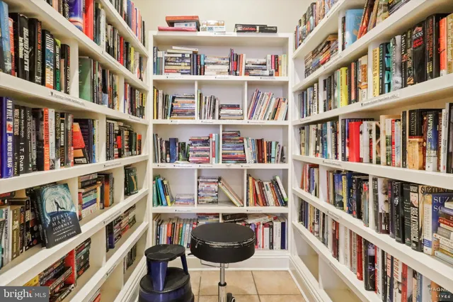 a view of a book shelf with lots of books