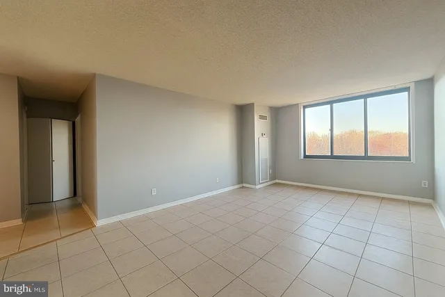 a view of an empty room and window