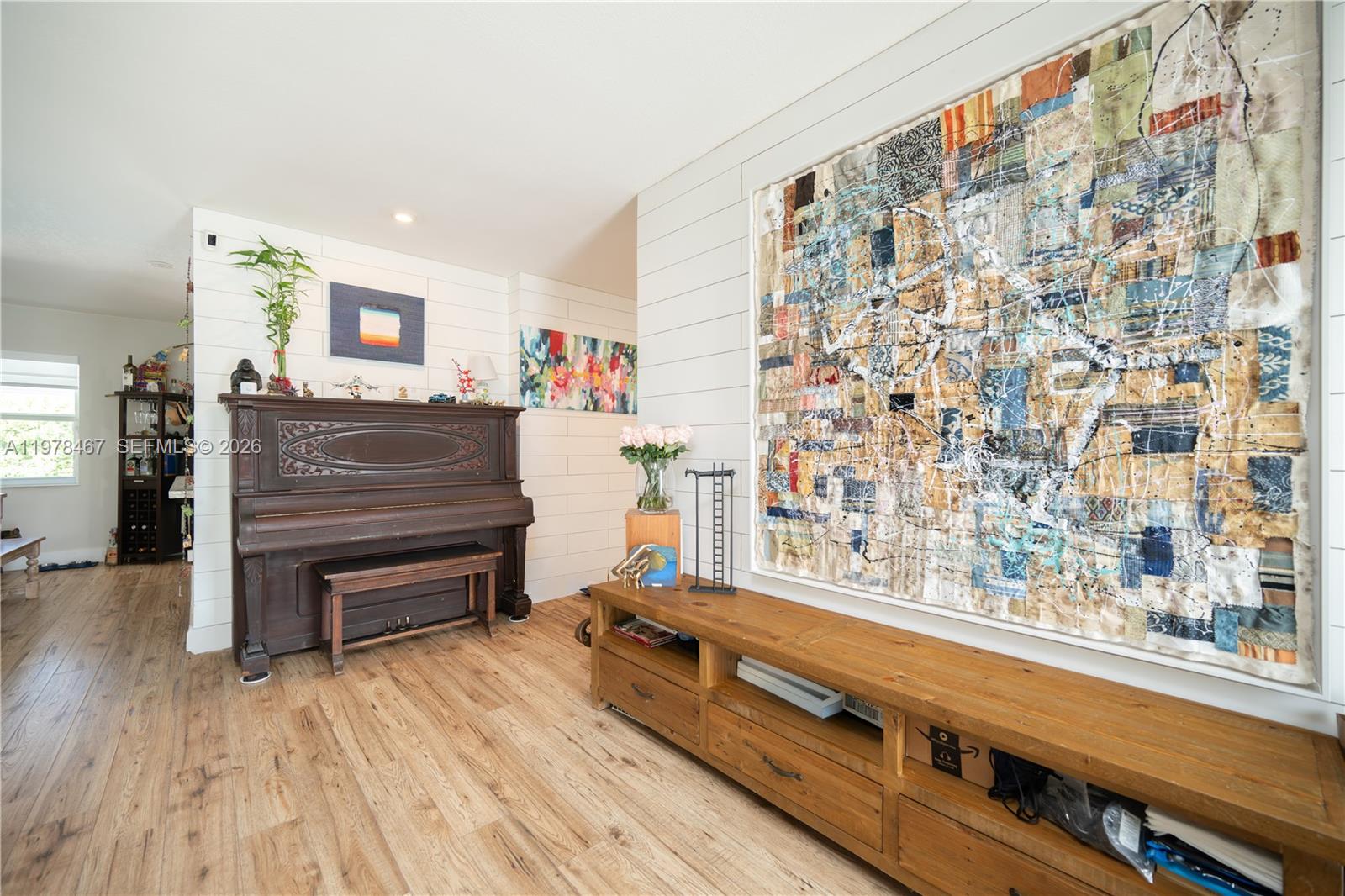 19431 Franjo Road Cutler Bay, FL 33157 - Photo 12 of 32 a living room with a wooden floor and a window