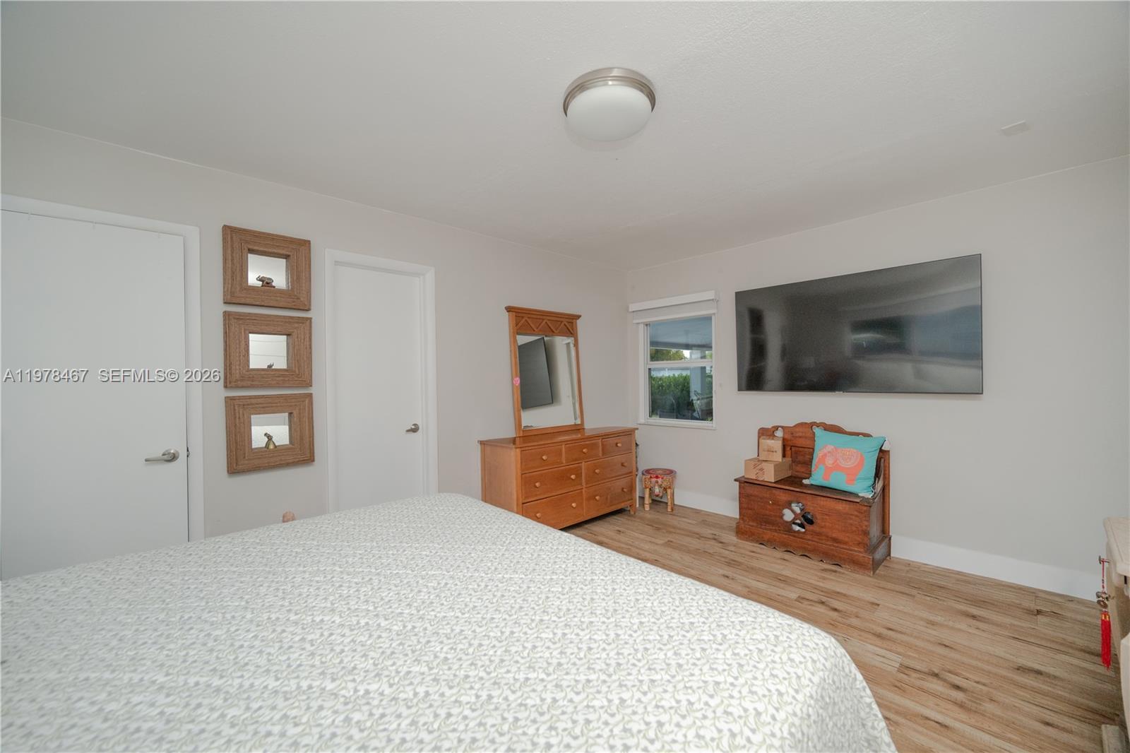 19431 Franjo Road Cutler Bay, FL 33157 - Photo 16 of 32 a bedroom with a bed and wooden floor