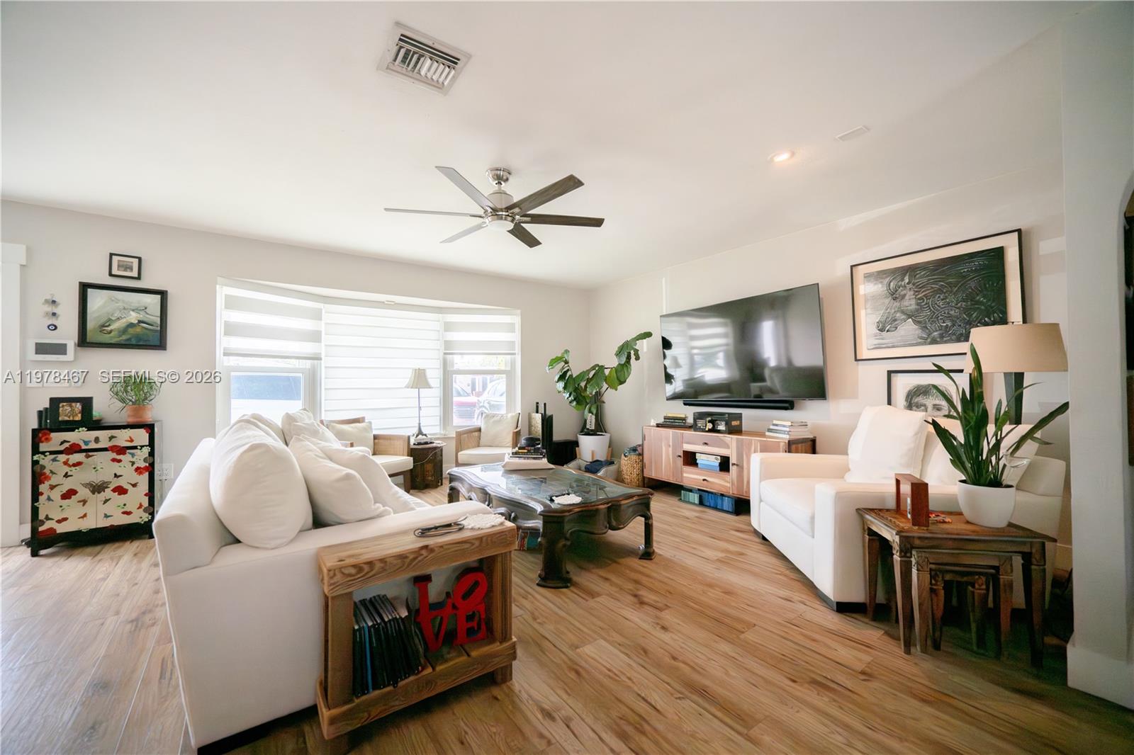 19431 Franjo Road Cutler Bay, FL 33157 - Photo 23 of 32 a living room with furniture fireplace and a window