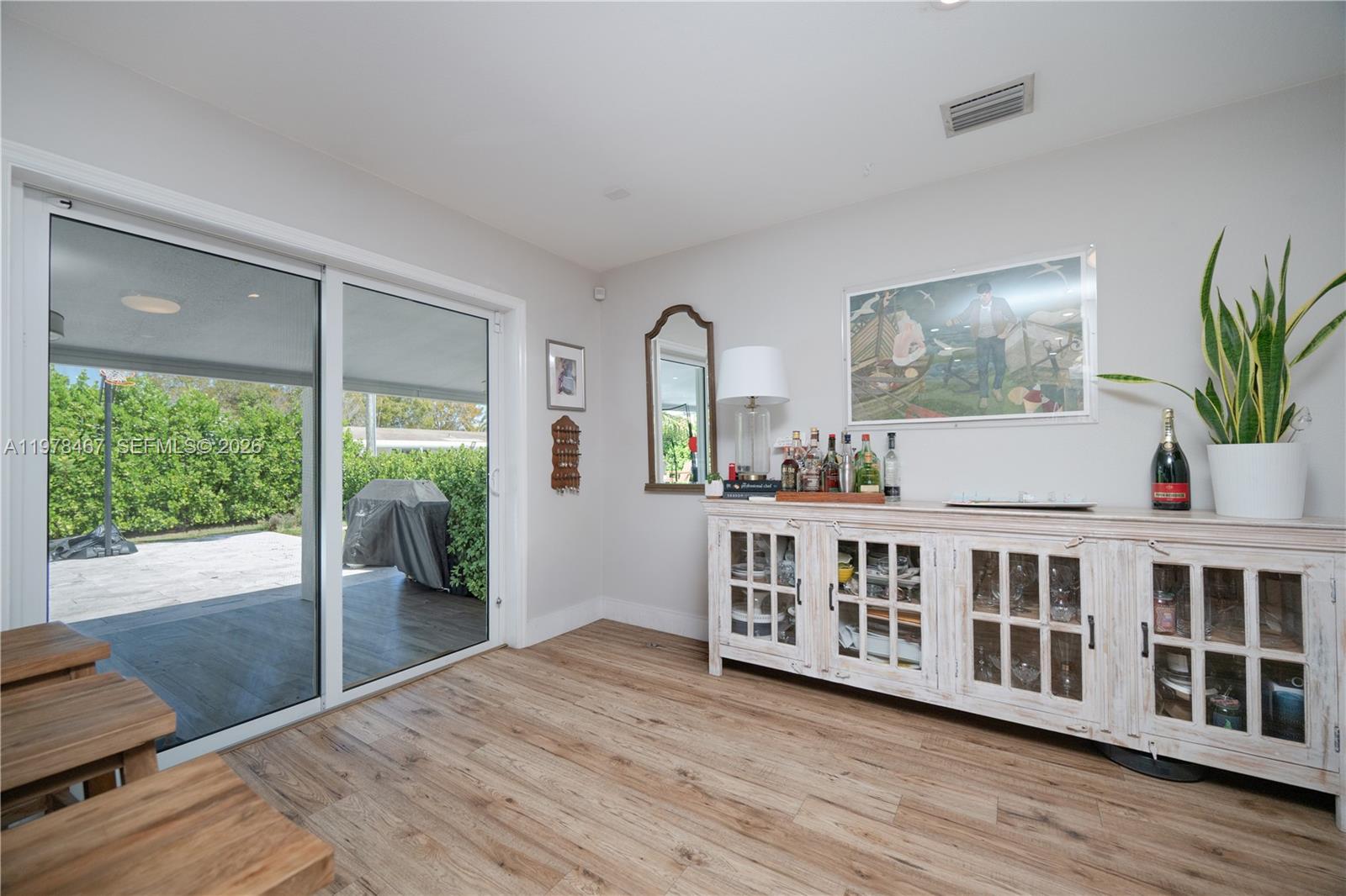 19431 Franjo Road Cutler Bay, FL 33157 - Photo 24 of 32 a view of living room with wooden floor and large window