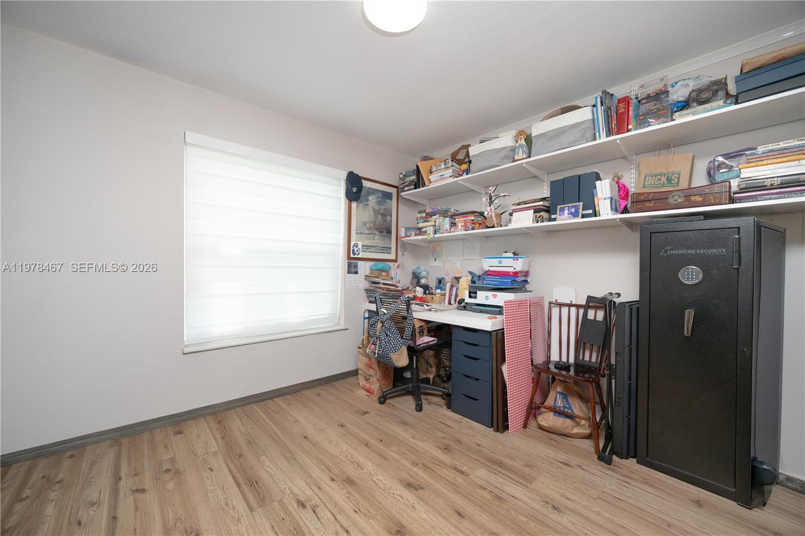 19431 Franjo Road Cutler Bay, FL 33157 - Photo 27 of 32 a view of a workspace with furniture and a window
