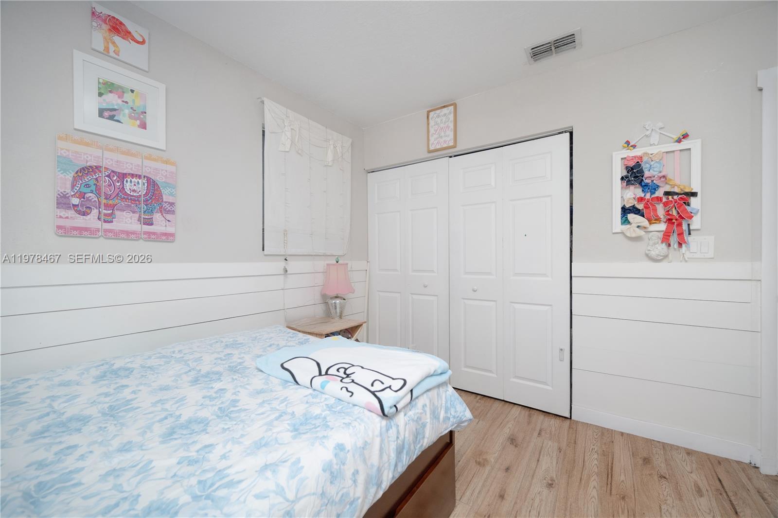 19431 Franjo Road Cutler Bay, FL 33157 - Photo 28 of 32 a bedroom with a bed and a window