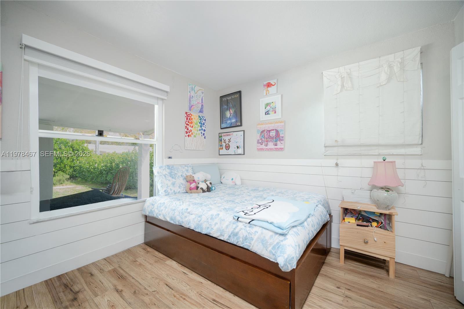 19431 Franjo Road Cutler Bay, FL 33157 - Photo 29 of 32 a bedroom with a bed and a window