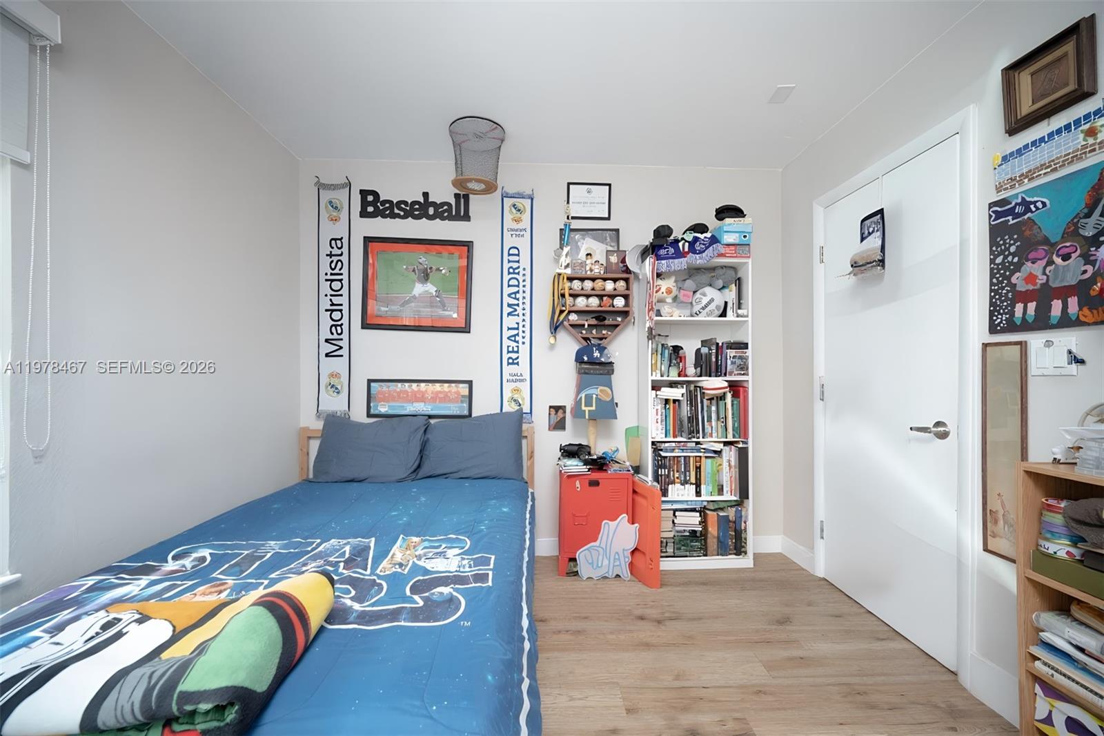 19431 Franjo Road Cutler Bay, FL 33157 - Photo 31 of 32 a bed room with a bed and a book shelf