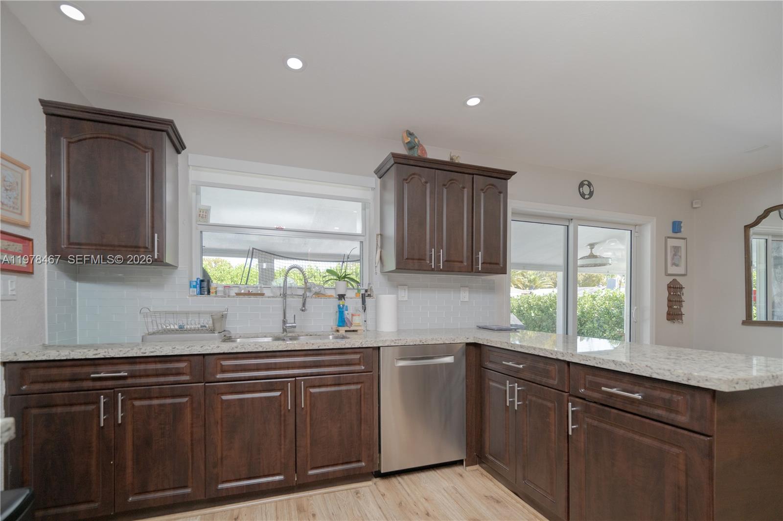 19431 Franjo Road Cutler Bay, FL 33157 - Photo 9 of 32 a kitchen with granite countertop cabinets stainless steel appliances a sink and a window