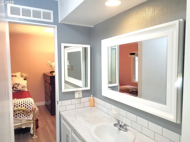 a bathroom with a sink and a mirror