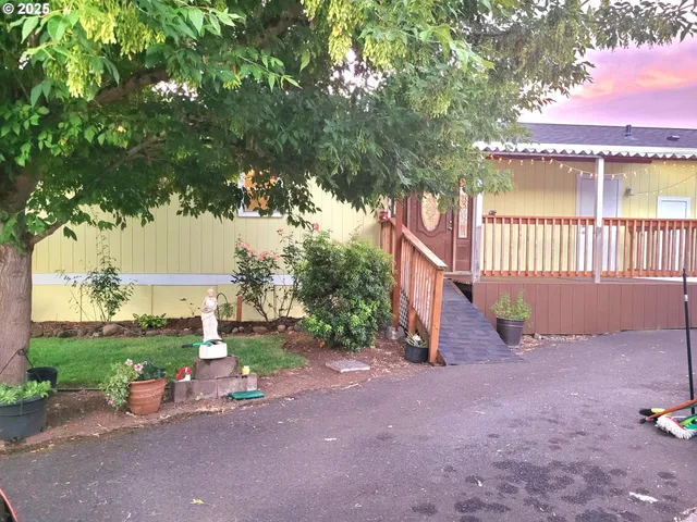 a view of a house with wooden fence