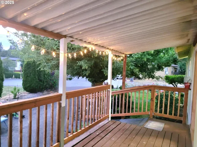 a view of a balcony with wooden floor