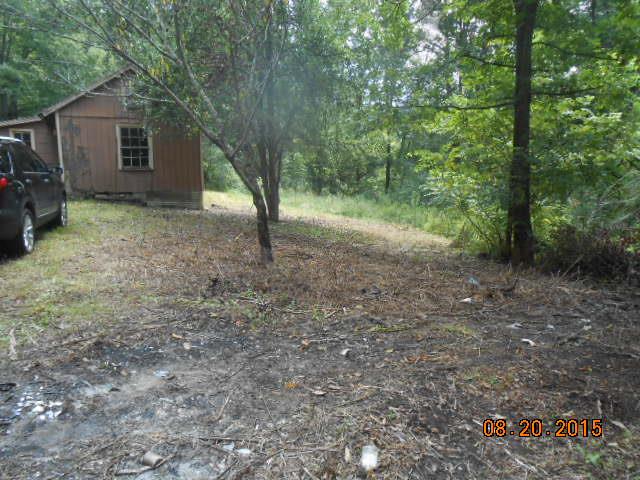 7390 Walker Road Fairview, TN 37062 - Photo 7 of 8 a view of a house with a backyard