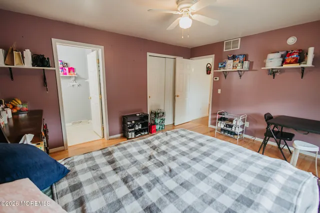 a bed room with a bed and a desk