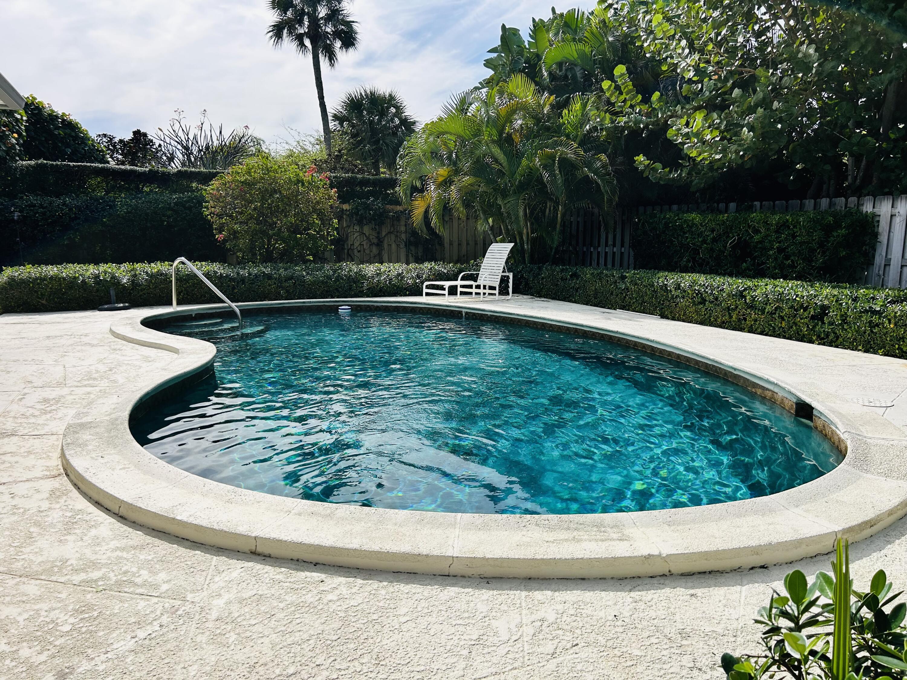 162 Beacon Lane Jupiter Inlet Colony, FL 33469 - Photo 15 of 16 a view of a swimming pool with a yard