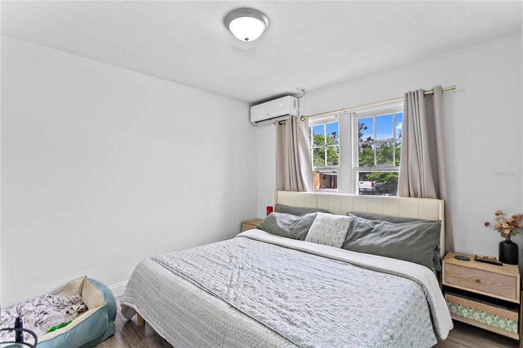 4762 Haines Road North St. Petersburg, FL 33714 - Photo 11 of 29 a bedroom with a bed and a window