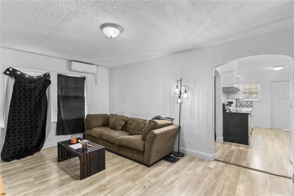 4762 Haines Road North St. Petersburg, FL 33714 - Photo 15 of 29 a living room with furniture and a wooden floor