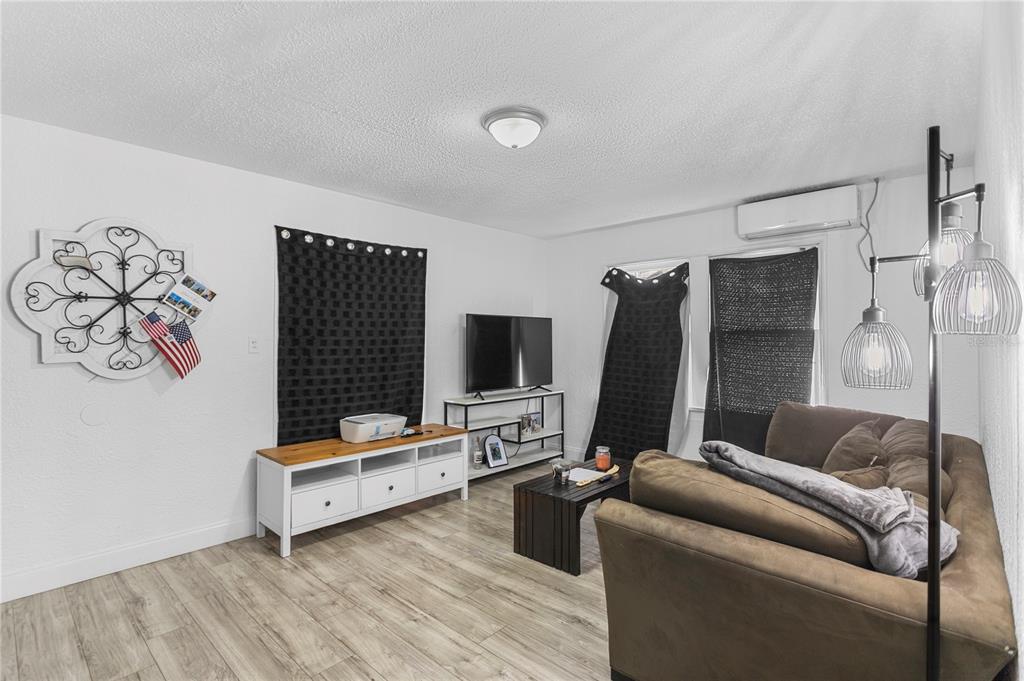 4762 Haines Road North St. Petersburg, FL 33714 - Photo 16 of 29 a living room with furniture and a flat screen tv