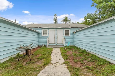 a view of a backyard with a sitting area