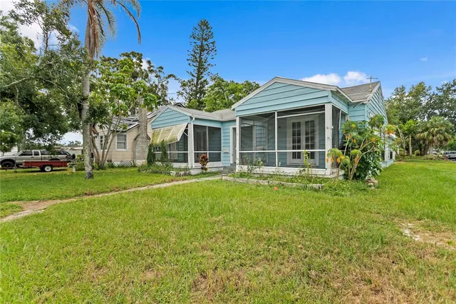 a view of a house with a yard