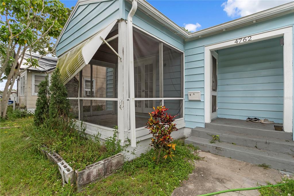 4762 Haines Road North St. Petersburg, FL 33714 - Photo 3 of 29 a front view of a house with a yard