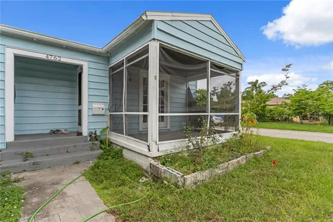 a view of backyard with a garden and plants