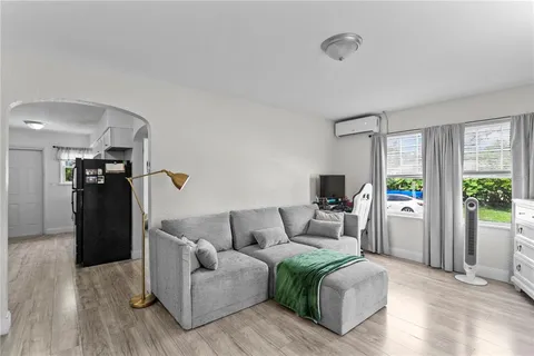 a living room with furniture and a window