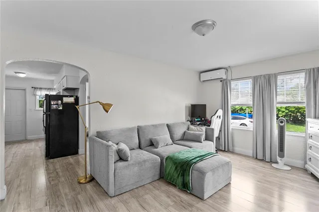 a living room with furniture and a window