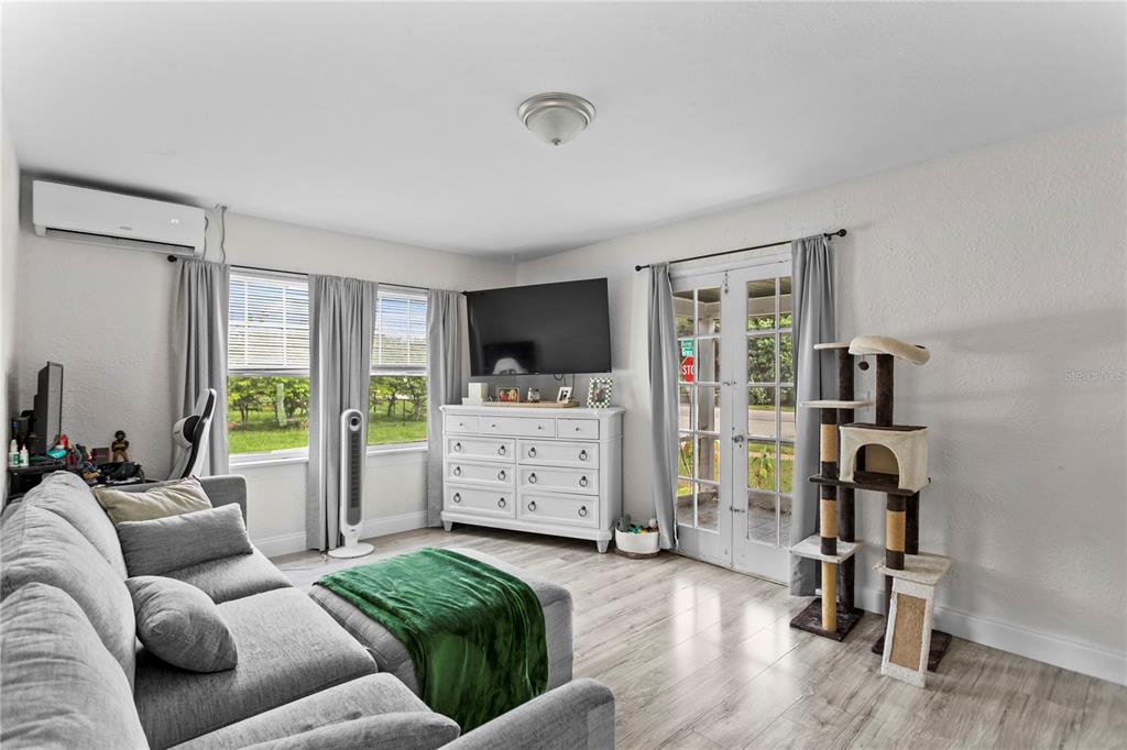 4762 Haines Road North St. Petersburg, FL 33714 - Photo 8 of 29 a living room with furniture and a flat screen tv