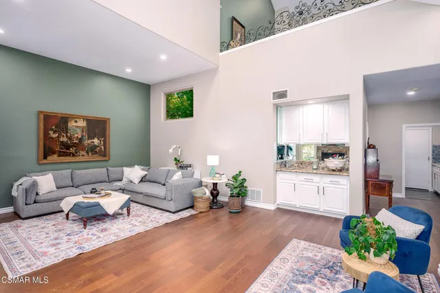 a workspace with furniture and wooden floor