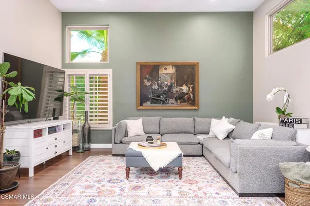 a living room with furniture and a table