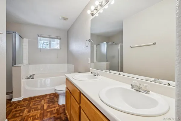 a bathroom with a bathtub and a sink