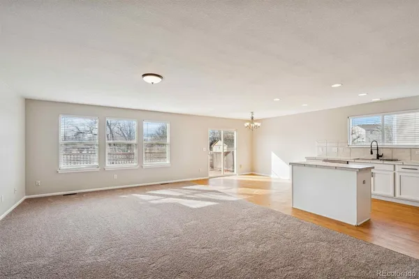 a view of a kitchen with a sink and a window