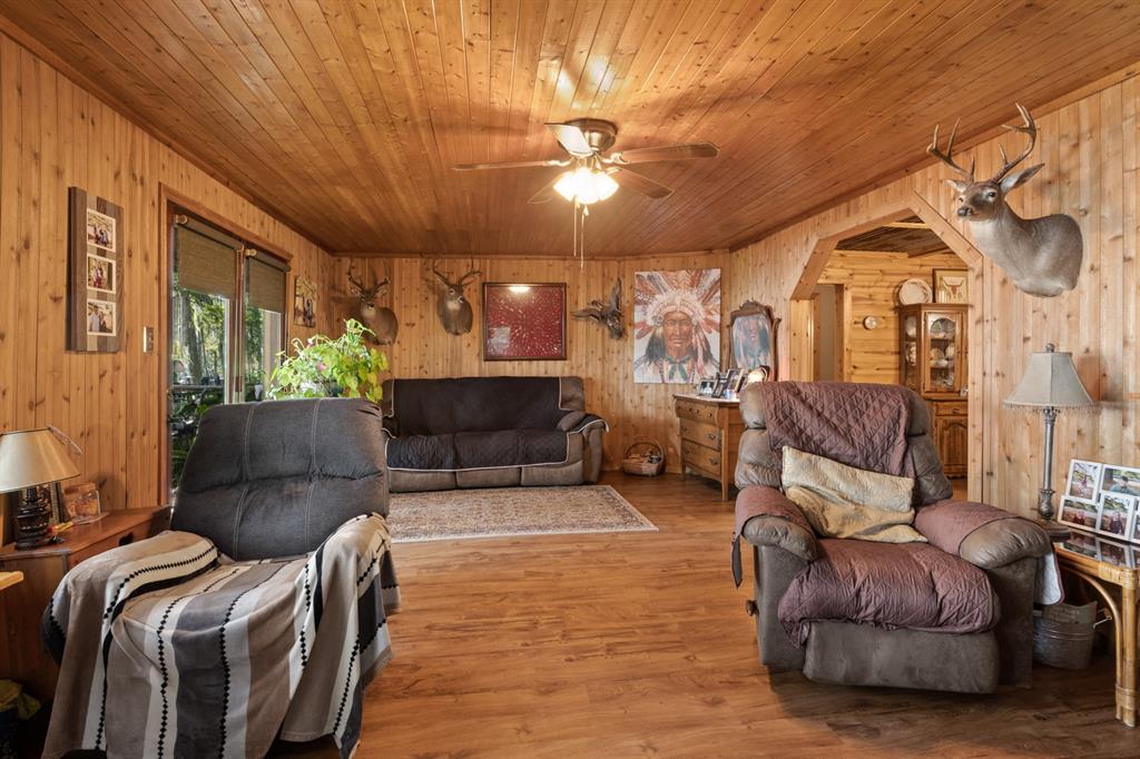 229 County Road Jefferson, TX 75657 - Photo 17 of 40 a living room with furniture and a chandelier