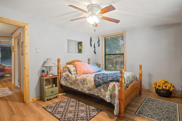 a bed room with a bed and a window