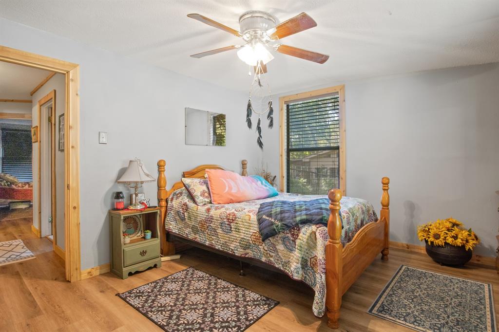 229 County Road Jefferson, TX 75657 - Photo 22 of 40 a bed room with a bed and a window