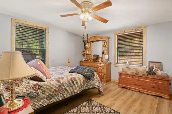 a bedroom with a bed and window