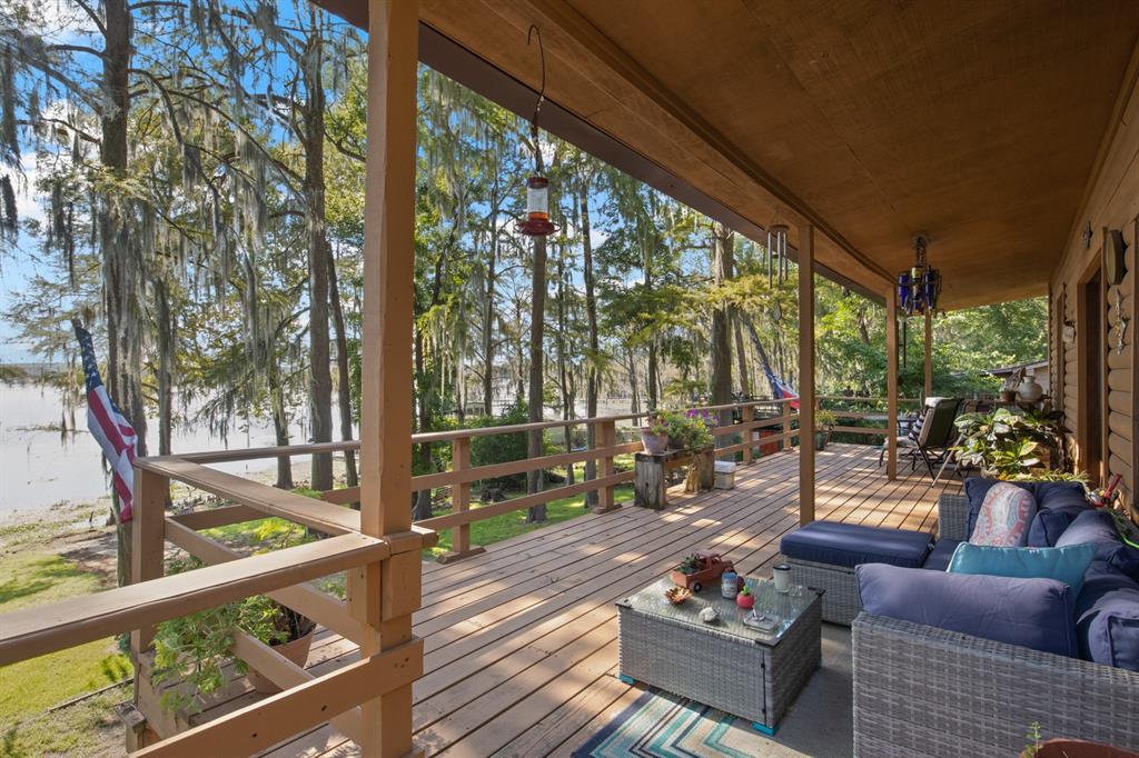 229 County Road Jefferson, TX 75657 - Photo 3 of 40 a outdoor living space with patio furniture and a potted plants